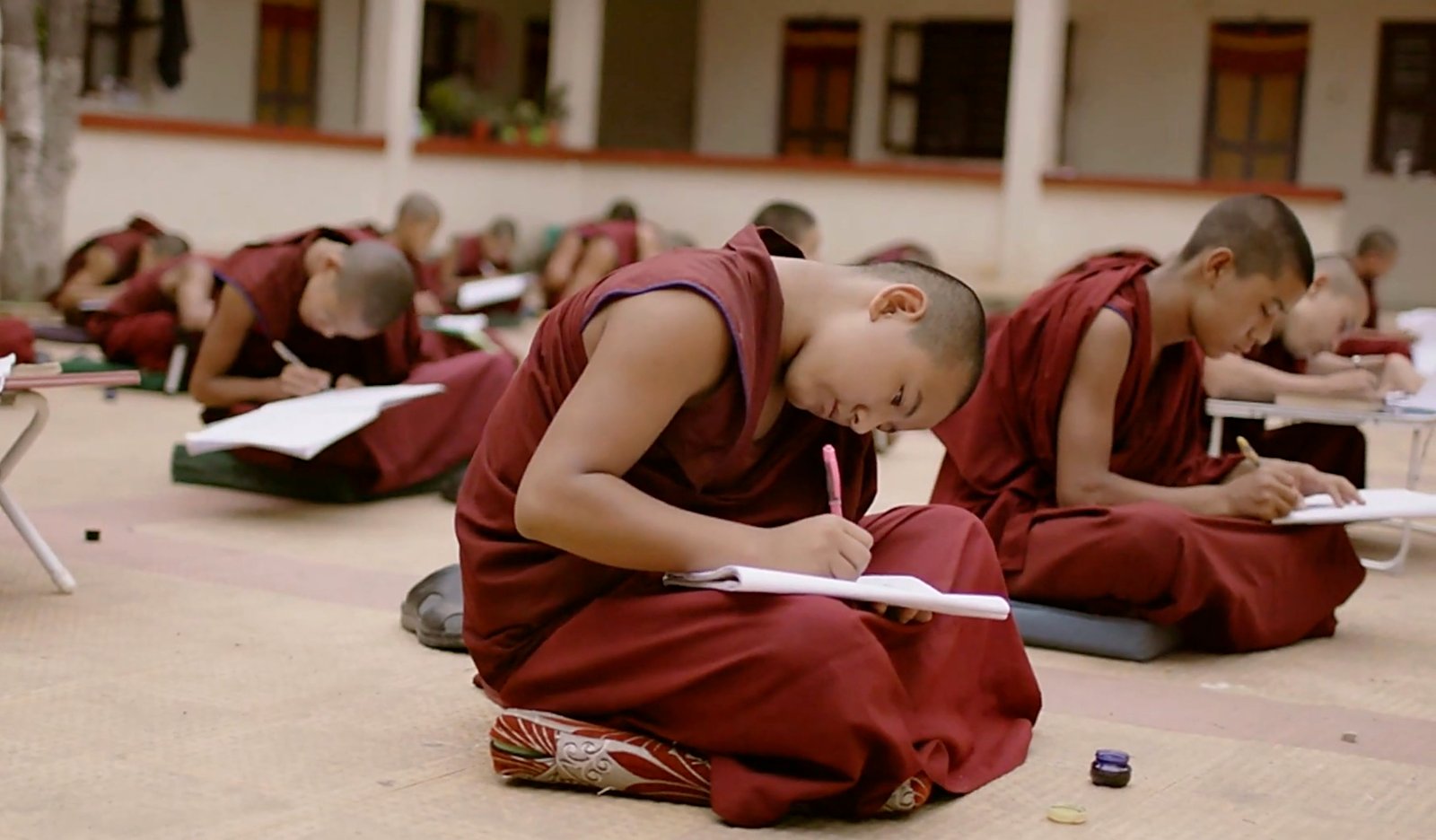 Young monks studying in the courtyard at Sera Mey, The Maitri Project